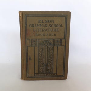 May include: A vintage book titled "Elson Grammar School Literature Book Four" with a brown cover and decorative border. The book is in good condition, with visible wear on the spine and edges. The text "Eighth Grade" is printed at the bottom.