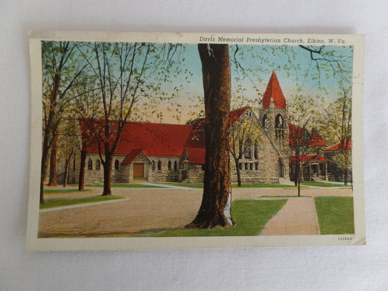 May include: A vintage postcard showing the Davis Memorial Presbyterian Church in Elkins, West Virginia. The church is a stone building with a red roof and a tall spire. The postcard is in good condition with some slight wear and tear.