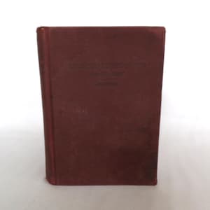 May include: A maroon-colored book titled "English Composition Book One" by Browne.