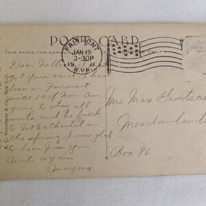 May include: A vintage postcard with a handwritten message. The postcard is addressed to Mrs. Max Groetsch, Box 96, Meadowlands, PA. The message reads, "Dear Helen, got your card & have been in Fairmont since 14 of Jan. Am going to stay all winter and be back to Int. & Chantal in the spring. I was glad to hear from you. Write again. Mayme."
