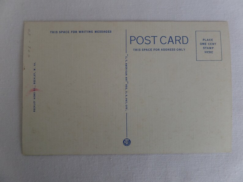 May include: A vintage postcard with the text "POST CARD" in blue lettering. The back of the card has instructions for writing messages and addresses, as well as a space for a stamp.