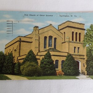 May include: A vintage postcard showing the First Church of Christ Scientist in Huntington, West Virginia. The building is constructed from yellow brick with a tall tower and a large arched entrance.