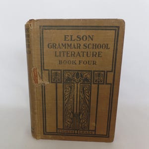 May include: A brown book titled "Elson Grammar School Literature Book Four Eighth Grade". The cover features an ornate design in black.