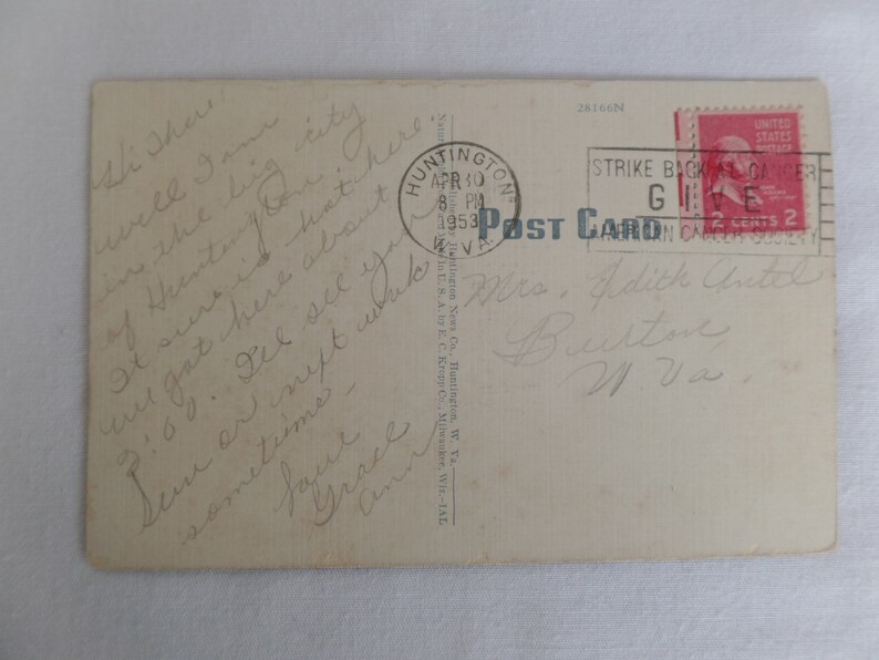 May include: A vintage postcard with a handwritten message. The postcard is addressed to Mrs. Addie Antell Button in West Virginia. The postcard has a Huntington, Virginia postmark dated 30 April 1953. The postcard has a 2-cent stamp with a picture of George Washington.