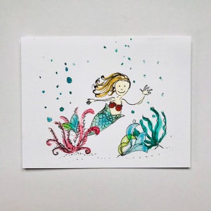 Sirène côtière colorée et coquille