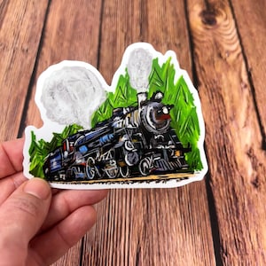 May include: A sticker of a cartoon steam train with black, blue, and red details, traveling through a green field with white smoke coming from the chimney.