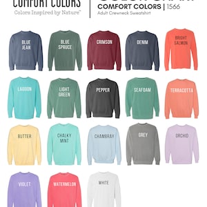 May include: Color chart for Comfort Colors adult crewneck sweatshirts. The chart shows 18 different colors, including blue jean, blue spruce, crimson, denim, bright salmon, lagoon, light green, pepper, seafoam, terracotta, butter, chalky mint, chambray, grey, orchid, violet, watermelon, and white.