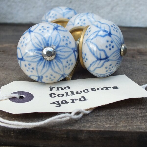 Hand painted round ceramic drawer knobs (Set of 2). Antique white with blue design.