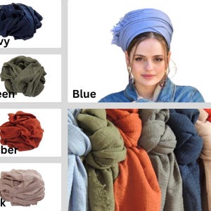 May include: A selection of colourful head wraps and scarves. Colours include navy, green, amber, and pink. A woman is wearing a blue head wrap. The image also shows a collection of scarves in various colours.