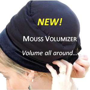 May include: A black velvet headband with a padded top, designed to add volume to hair. The headband says "NEW! MOUSS VOLUMIZER Volume all around..."