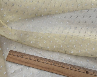 May include: Pale yellow sheer fabric with a white polka dot pattern. The fabric is measured with a ruler in inches. A white label with the text "silks4less.com Article # 0158" is visible.