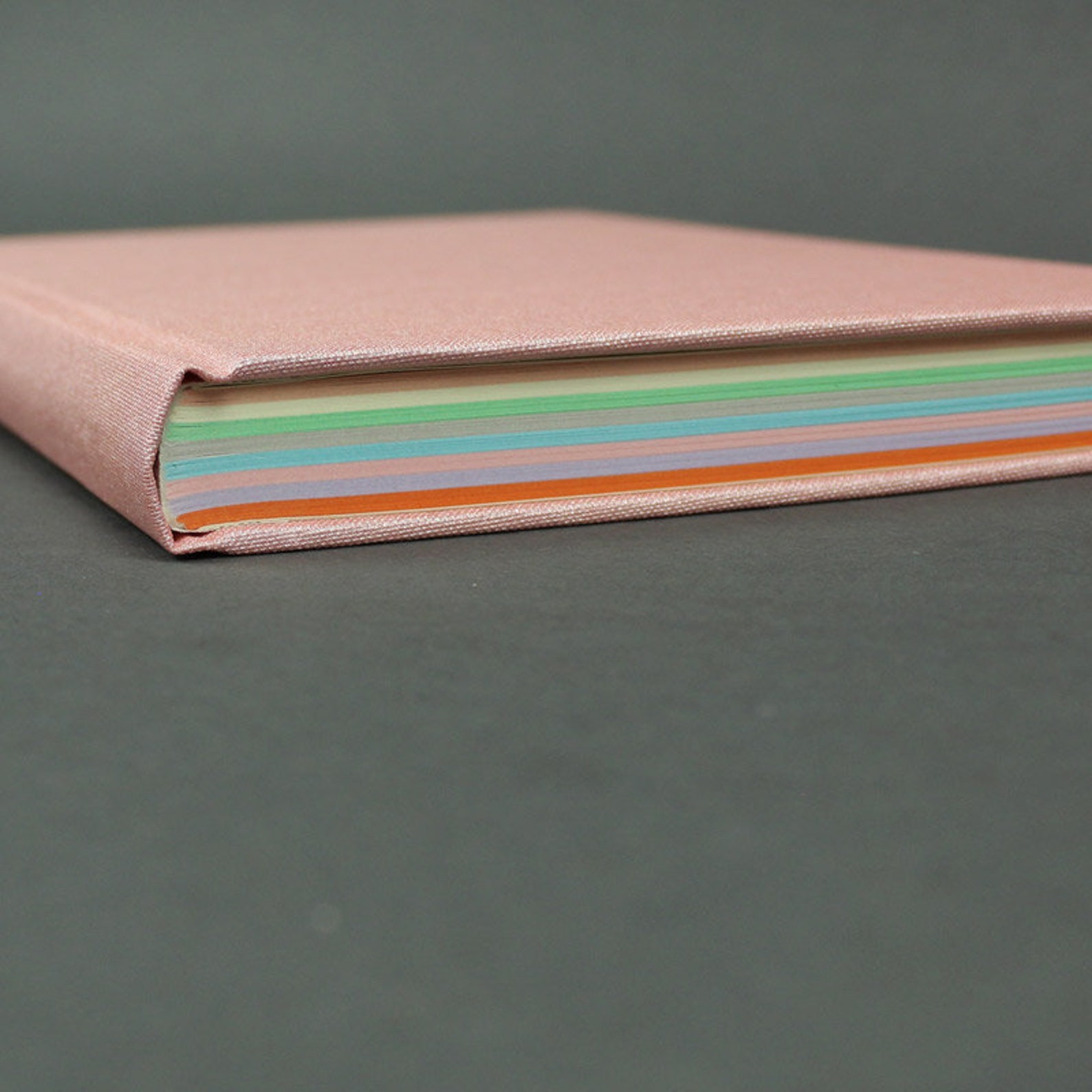simple notebook covered with pink linen with lined