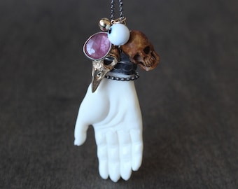 St. Charles Ave. - NOLA Voodoo Talisman Necklace, Handmade, Carved Bone Hand, Skull, Evil Eye, Raven Skull, Rose Cut Fissure Filled Sapphire