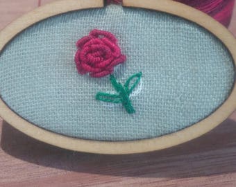 Hand embroidered flower brooch in a mini embroidery hoop with bullion knot rose