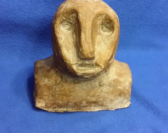 A Clay Sculpture of a Neanderthal Man