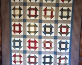 Churn Dash quilt. 57 x 80 inches. A traditional block pattern in old-fashioned colors.