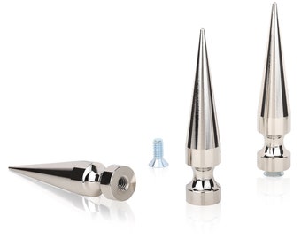 May include: Three silver metal spikes with a pointed tip and a threaded base. The spikes are designed for use as decorative accents or for adding a punk rock aesthetic to objects.
