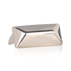 May include: Silver metal corner protector with a rectangular shape and angled edges.