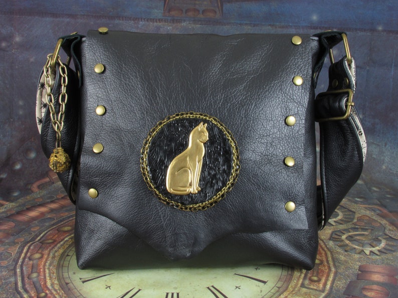 Steampunk Cat Shoulder Bag with Raw Black Leather, Brass Vintage Cat, Filigree Capsule, Locket, Tea-dyed Cotton, & Rivets by Phantazmagorium Bild 1