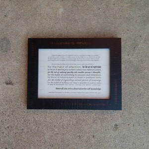 May include: A framed print with a black frame and a white background. The print features a quote about the importance of self-knowledge. The quote reads: "Above all you write a dissertation for self-knowledge."