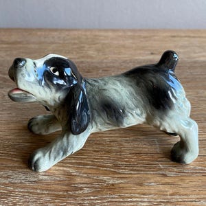 Goebel vintage porcelain dog figurine playful black and white spaniel
