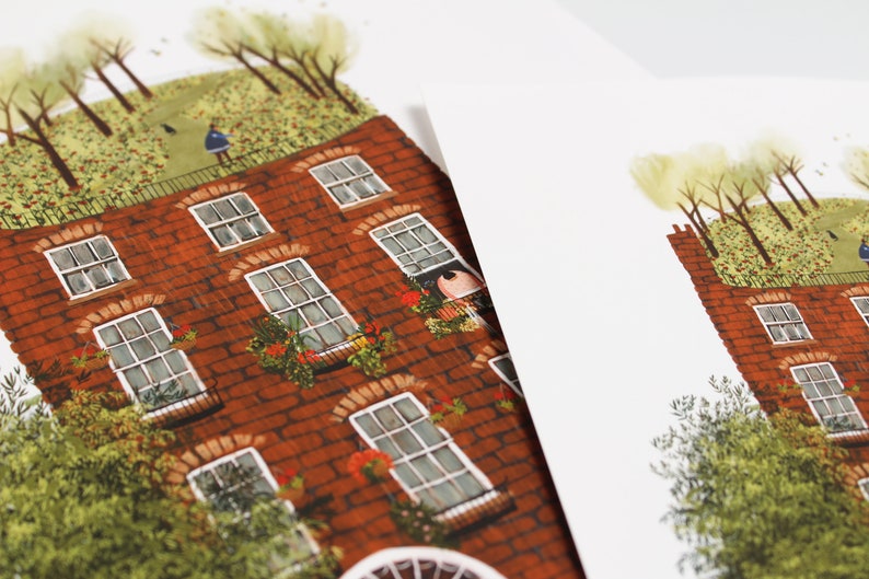 May include: A red brick building with a green roof and windows. The building has a garden on the roof with trees and flowers.