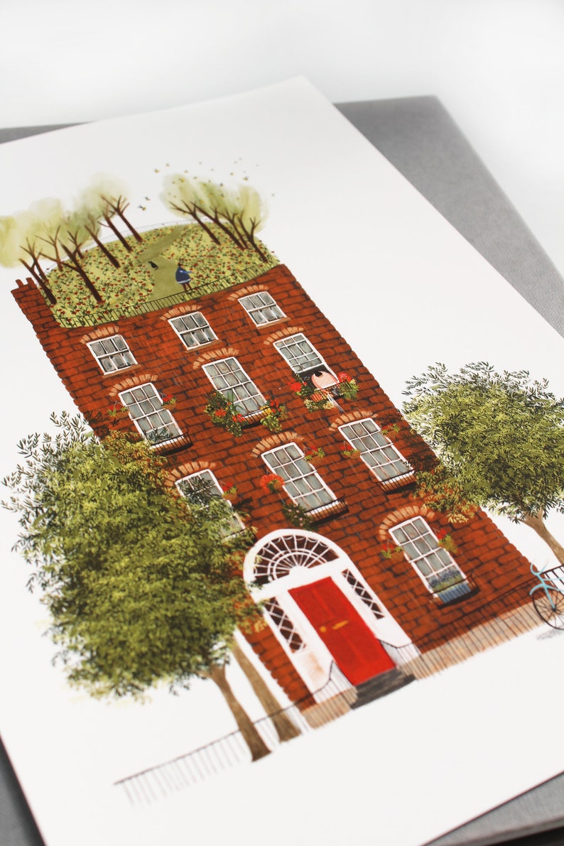 May include: A red brick building with a green roof and a red door. The building has many windows and is surrounded by trees.
