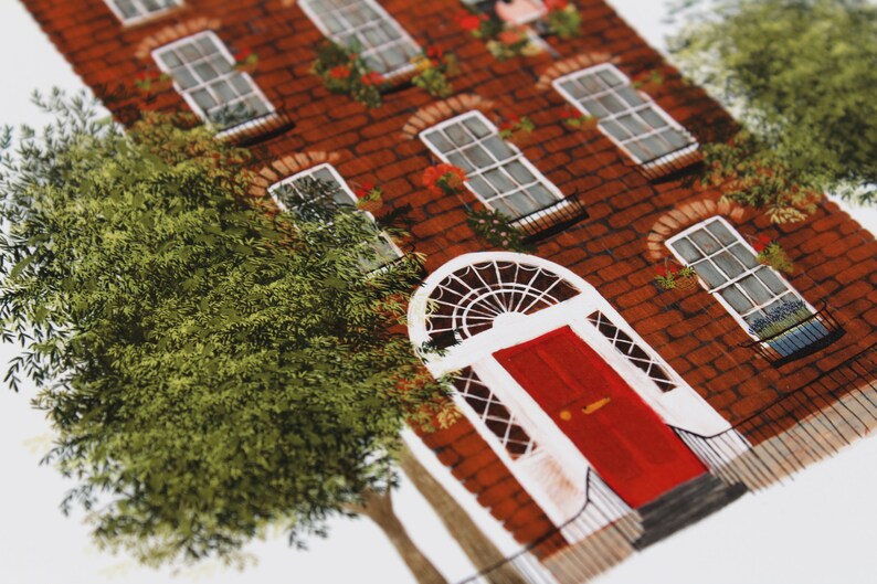 May include: A red brick building with a red door and white trim. The building has several windows with white trim and green plants growing in pots on the windowsills. There is a tree in the foreground.