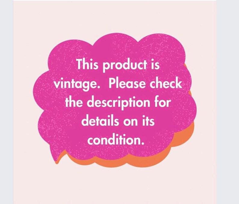 May include: A pink speech bubble with the text: "This product is vintage. Please check the description for details on its condition." The bubble has an orange outline and is set against a light pink background.