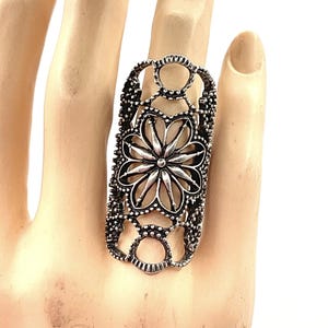 May include: A rustic wooden sign with the text "Welcome to our home" in white lettering. The sign features a distressed finish and a simple, inviting design, perfect for entryway decor.