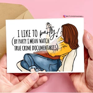 May include: A greeting card with a cartoon illustration of a woman watching television. The text on the card reads "I like to party! (By party I mean watch true crime documentaries)"