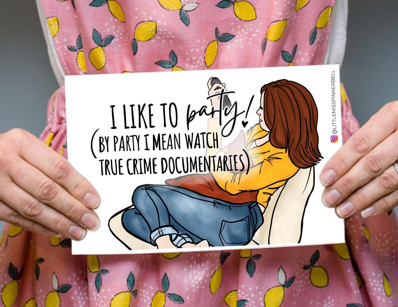 May include: A white card with a cartoon illustration of a person watching television. The text on the card reads "I like to party! (By party I mean watch true crime documentaries)"