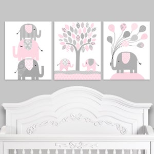 Set of three baby pink and gray elephant nursery art prints for a baby girl's room consisting of feminine patterns available as paper or canvas prints in many size options.