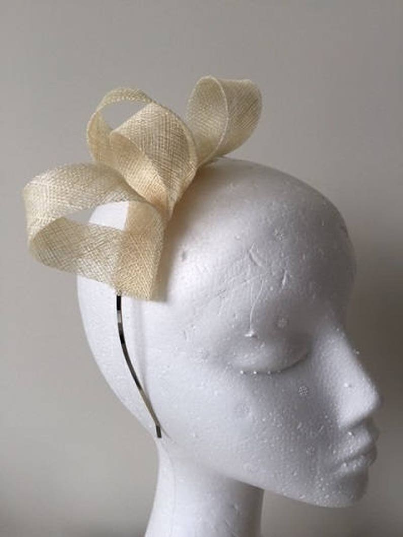 Stunning on! Cream loop fascinator on a metal headband