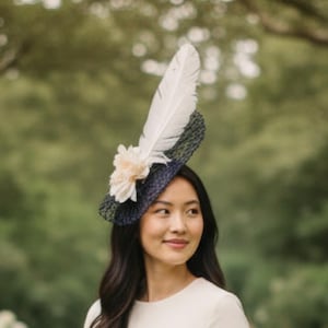 Navy Basket Weave Fascinator, Cream Flower & cream Feathers on a white button base and secured with a headband.