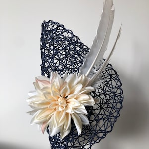 NEW navy blue basket weave on a white round base with cream flower and brown feathers!