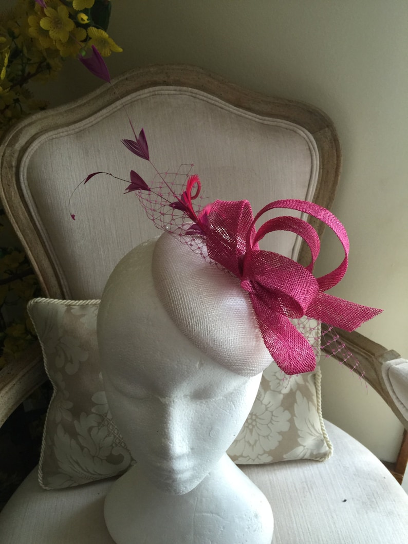 Gorgeous white round fascinator with magenta loops, feathers and netting. Made to order image 1