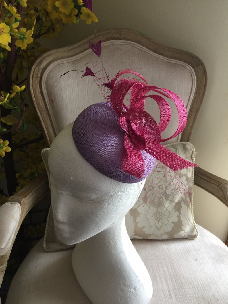 Stunning! feathers and netting Gorgeous lilacpurple round fascinator with magenta loops