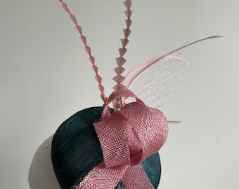 Teal fascinator with round base and pink loops, netting and feathers. Made to order!