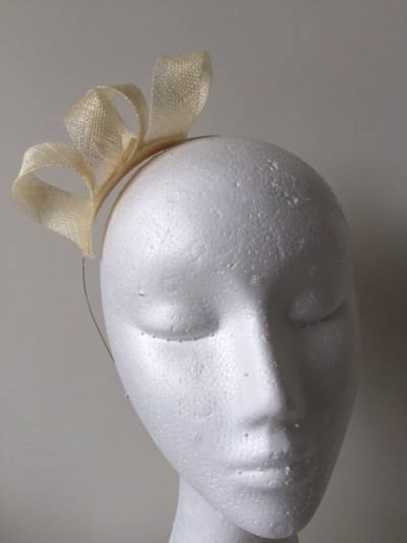 Stunning on! Cream loop fascinator on a metal headband