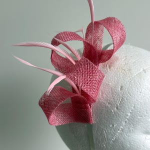 Pink sinamay loop fascinator with feathers on a headband!