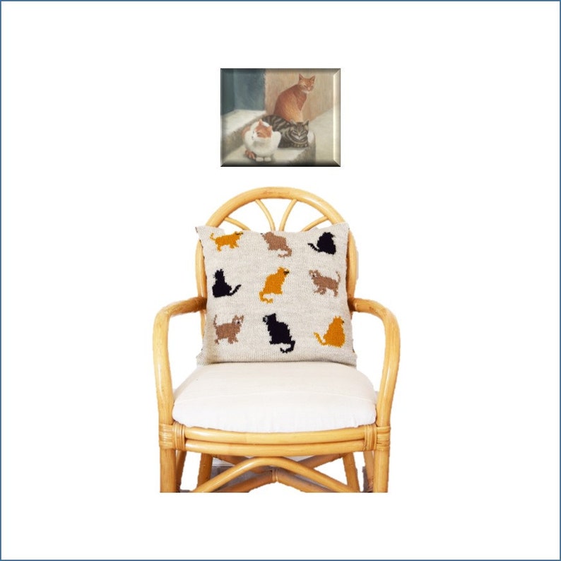 May include: A decorative pillow with various cat silhouettes in black, brown, and orange on a light beige background. The pillow is on a white cushion, set on a natural rattan chair. Above, a framed painting depicts three cats.