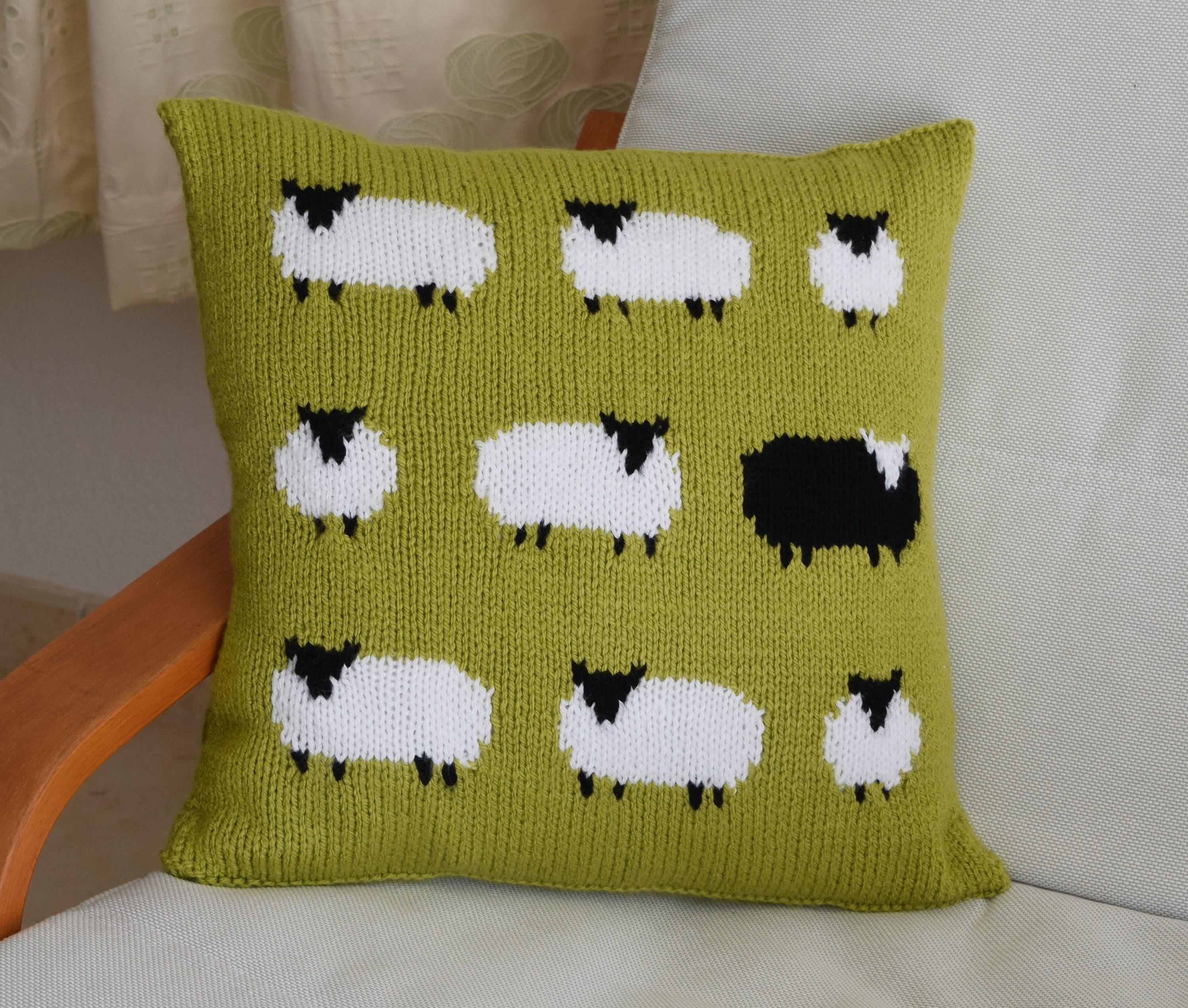 Knitting Pattern for a Sheep Cushion using Aran or Worsted Wool Pillow with a Flock of Sheep including one Black Sheep Knitting Patterns
