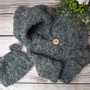 Hand made crochet layette in incredibly soft Teddy bear yarn. Outfit is a jacket and hat set.  Perfect baby shower gift.