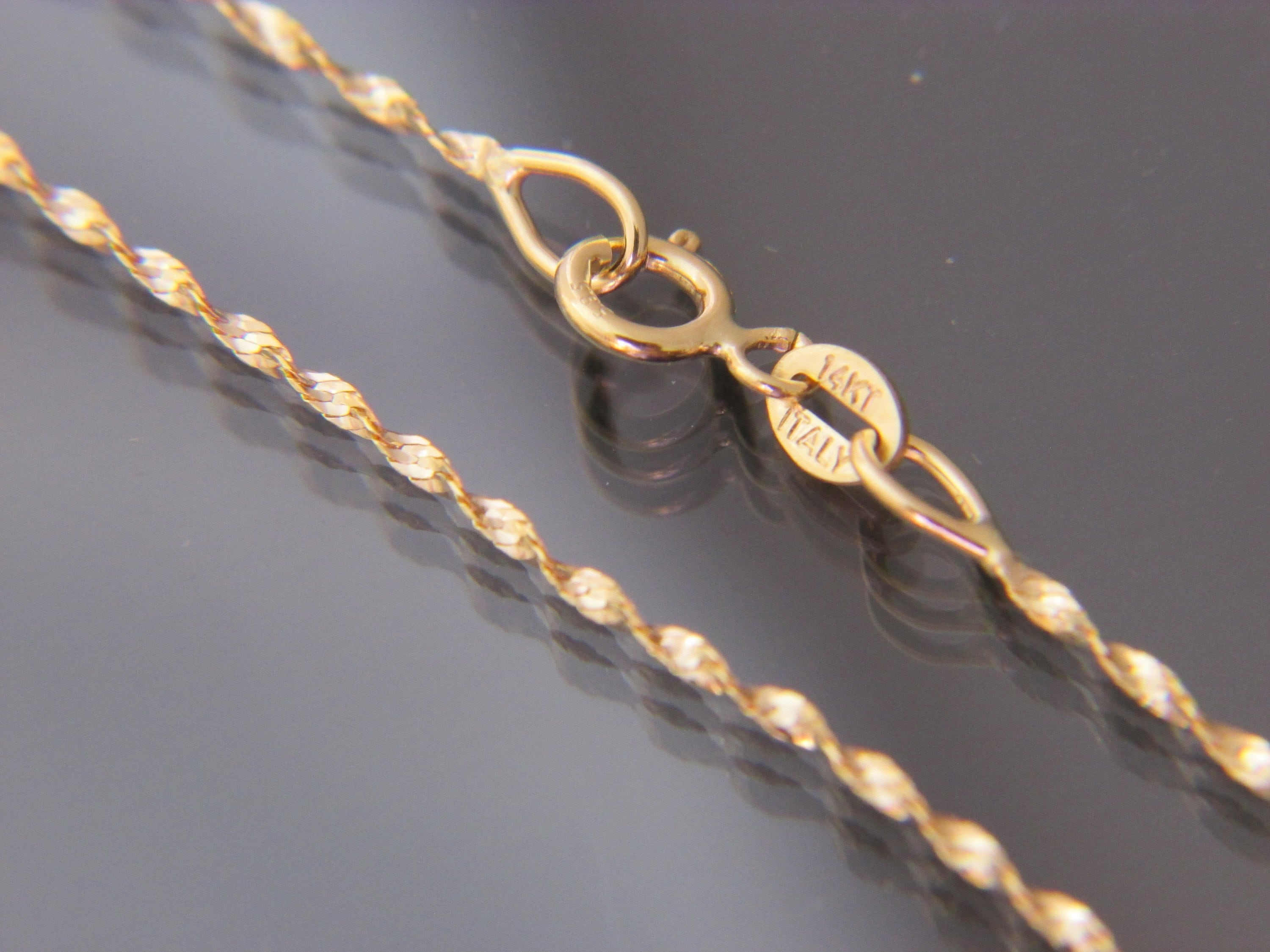 14kt Yellow Gold Flexible Twisted OMEGA 
