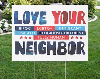 May include: A rectangular yard sign with a white background featuring the text LOVE YOUR NEIGHBOR in large blue and red letters. Below are the words BIPOC, LGBTQ+, IMMIGRANT, DISABLED, RELIGIOUSLY DIFFERENT, and FULLY HUMAN with six red stars.