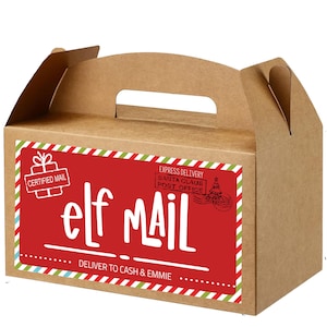 May include: A brown cardboard gift box with a handle, featuring a red label with the words "elf MAIL" in white. The label also includes "CERTIFIED MAIL" and "EXPRESS DELIVERY SANTA CLAUS POST OFFICE" text. The box is decorated with green and red stripes.