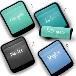 May include: Set of four personalized car seat belt covers. The covers are made of a soft, comfortable material and feature a variety of colors and names. The names are printed in white on the covers. The covers are numbered 5, 6, 7, and 8.