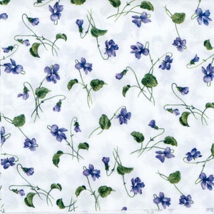 May include: A white fabric with a repeating pattern of small purple flowers with green stems and leaves.
