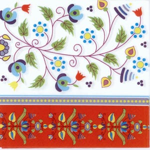 May include: A square paper napkin with a floral design. The top portion features a white background with a purple vine and blue, yellow, and red flowers. The bottom has a red border with a repeating floral pattern.